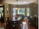 Bright dining room with bay window and wood table at 1145 Lake Stone Lea Dr, Oxford, GA 30054