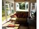 Sunroom with wicker furniture and access to backyard at 1145 Lake Stone Lea Dr, Oxford, GA 30054