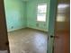 Small bedroom with light green walls and wood-look flooring at 175 Moss Dr, Mcdonough, GA 30252