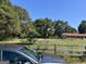 Brick ranch house with red roof, situated on a large lot at 175 Moss Dr, Mcdonough, GA 30252