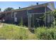 Brick house exterior with chain link fence and overgrown yard at 175 Moss Dr, Mcdonough, GA 30252