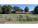 Brick ranch house with red roof, situated on a large lot at 175 Moss Dr, Mcdonough, GA 30252