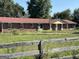 Brick ranch house with red roof, situated on a large lot at 175 Moss Dr, Mcdonough, GA 30252