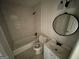 Updated bathroom with tub, toilet, and vanity at 2101 Ann Se Ct, Conyers, GA 30013