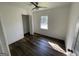 Bright bedroom with hardwood floors and a closet at 2101 Ann Se Ct, Conyers, GA 30013