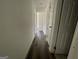Clean and bright hallway with hardwood flooring at 2101 Ann Se Ct, Conyers, GA 30013