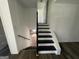 Dark stained wood staircase leading to the upper level at 2101 Ann Se Ct, Conyers, GA 30013