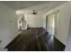 Bright living room with hardwood floors, ceiling fan, and sliding glass doors at 2101 Ann Se Ct, Conyers, GA 30013
