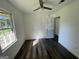 Bright bedroom with wood-look floors and ceiling fan at 2101 Ann Se Ct, Conyers, GA 30013