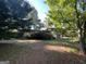 Ranch-style home nestled amongst lush green trees at 2101 Ann Se Ct, Conyers, GA 30013