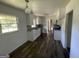Renovated kitchen with white cabinets, granite counters, and stainless steel appliances at 2101 Ann Se Ct, Conyers, GA 30013