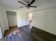 Bedroom with closet and wood-look floors needing repair at 2101 Ann Se Ct, Conyers, GA 30013