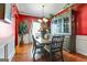 Formal dining room with hardwood floors and a large hutch at 2319 Sawgrass Dr, Hampton, GA 30228