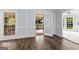 Dining room with hardwood floors and access to a screened porch at 330 N Fayette Dr, Fayetteville, GA 30214