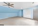 Spacious bedroom with light blue walls, carpeting, and double closet at 330 N Fayette Dr, Fayetteville, GA 30214