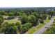 Aerial view of property showing home, detached garage, and expansive green space at 1112 Harbins Rd, Dacula, GA 30019
