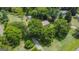 Aerial perspective of house nestled amongst trees on a large lot at 1112 Harbins Rd, Dacula, GA 30019