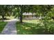 Brick ranch house exterior with a covered porch and mature landscaping at 1112 Harbins Rd, Dacula, GA 30019