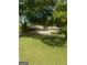 Ranch-style home with front porch and lawn at 1112 Harbins Rd, Dacula, GA 30019