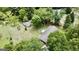 Aerial view of property with a house, separate building, and a large yard at 1112 Harbins Rd, Dacula, GA 30019
