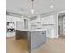 White kitchen with large island and stainless steel appliances at 160 Paislee Park (Lot #7 Paislee Park) Dr, Fayetteville, GA 30215