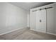 Bedroom with barn door and wall mounted shelving at 125 Leverett Ct, Fayetteville, GA 30215