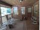 Relaxing back porch with rocking chairs and swing at 7505 Hall Rd, Fairburn, GA 30213