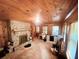 Home office with wood walls and stone fireplace at 7505 Hall Rd, Fairburn, GA 30213