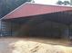 Spacious barn with metal siding and ample storage space at 7505 Hall Rd, Fairburn, GA 30213