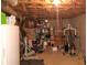 Partially finished basement with gym equipment and storage at 7505 Hall Rd, Fairburn, GA 30213