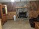 Basement with stone fireplace and leather recliner at 7505 Hall Rd, Fairburn, GA 30213