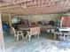 Covered patio area with wooden table and chairs at 7505 Hall Rd, Fairburn, GA 30213