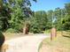 Brick entrance pillars and wrought iron gate at 573 Lester Rd, Fayetteville, GA 30215