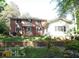 Two-story home with brick and siding exterior at 573 Lester Rd, Fayetteville, GA 30215