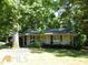 Ranch style home with a covered porch at 573 Lester Rd, Fayetteville, GA 30215