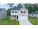 Two-story house with brick and siding exterior at 576 Whitman (Lot 2020) Ln # 2020, Stockbridge, GA 30281