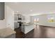 Open concept kitchen with gray cabinets and granite countertops at 536 Whitman (Lot 2010) Ln # 2010, Stockbridge, GA 30281