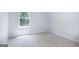 Bright bedroom with carpeted floor and large window at 619 Whitman Ln # 2200, Stockbridge, GA 30281