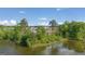 Serene lakefront view with dense trees in the background at 619 Whitman Ln # 2200, Stockbridge, GA 30281