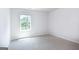 Simple bedroom with carpeted floor and a window at 619 Whitman Ln # 2200, Stockbridge, GA 30281