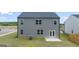 Two-story house with gray siding, stone accents, and a covered porch at 619 Whitman Ln # 2200, Stockbridge, GA 30281