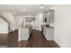 Open concept kitchen with gray cabinets and granite countertops at 619 Whitman Ln # 2200, Stockbridge, GA 30281
