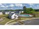 Aerial view of community pool, clubhouse, and homes at 619 Whitman Ln # 2200, Stockbridge, GA 30281