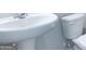 Clean bathroom with pedestal sink and toilet at 619 Whitman Ln # 2200, Stockbridge, GA 30281