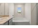 Bathroom features a garden tub and vanity at 619 Whitman Ln # 2200, Stockbridge, GA 30281