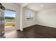 Living room with hardwood floors and view at 619 Whitman Ln # 2200, Stockbridge, GA 30281
