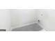 Small laundry room with gray tile floor at 619 Whitman Ln # 2200, Stockbridge, GA 30281