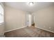 Simple bedroom with carpet and door to hallway at 78 Candlelight Ln, Atlanta, GA 30331