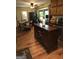 Kitchen boasts a large island with wine rack and wood cabinets at 2531 Quentin Dr, Jonesboro, GA 30236
