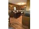 Galley style kitchen with ample cabinetry and a stainless steel refrigerator at 2531 Quentin Dr, Jonesboro, GA 30236